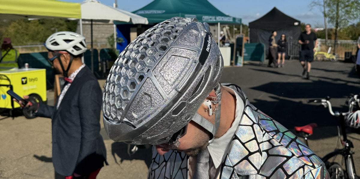Rider in a silver Newlane foldable helmet and holographic jacket at the Brompton World Championship 2026, Lee Valley VeloPark